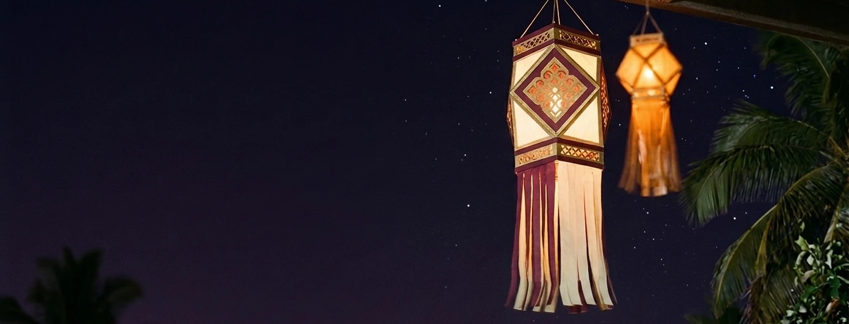 Glowing Diwali lanterns under a starry night sky promotion
